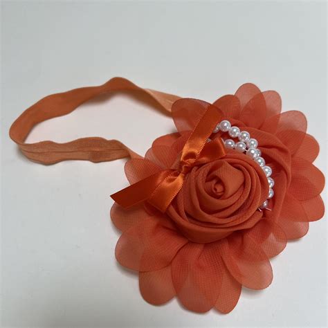 Kūdikio galvos juostelė su gėle