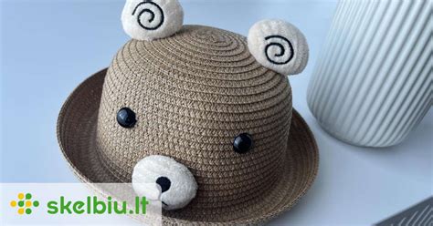 UV apsaugos simboliai ant vaikiškų kepurių